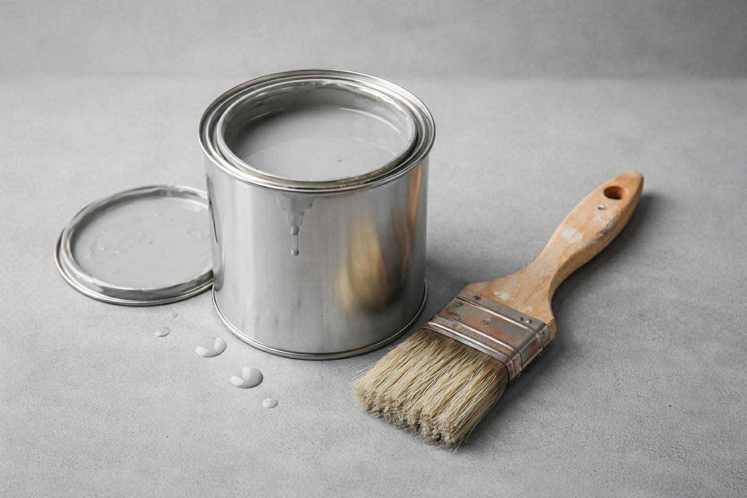 Paint tin and brush ready on the floor